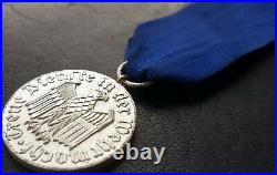 10751? German army post WW2 1957 pattern Long Service Award 4 Years Medal