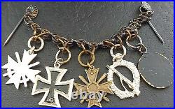 10829? German post WW2 1957 pattern miniature chain Iron Cross Wound Badge