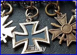 10829? German post WW2 1957 pattern miniature chain Iron Cross Wound Badge