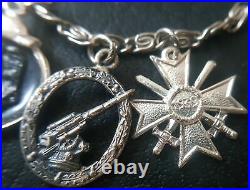 7903? German post WW2 1957 pattern miniature chain War Merit Cross Wound Badge