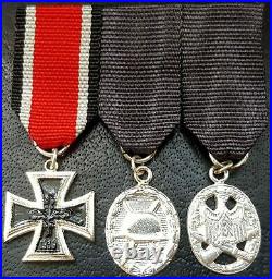 9852? German post WW2 1957 pattern mounted miniatures Iron Cross Assault Badge
