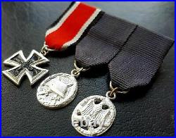 9852? German post WW2 1957 pattern mounted miniatures Iron Cross Assault Badge