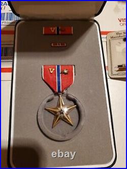 Bronze star medal valor cluster named In box