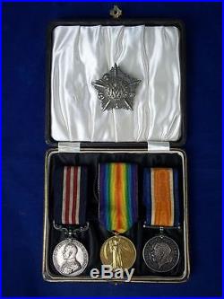 First World War Military Medal Trio and Cap Badge PTE W Sharett Machine Gun Corp