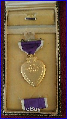 WW11 purple heart, flying cross, air medal, pins, and key chains and dog tags