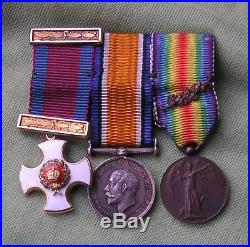 WW1. BRITISH MINIATURE MEDAL GROUP OF 3. (D. S. O. 18ct. GOLD) WAR / VICTORY (MID)